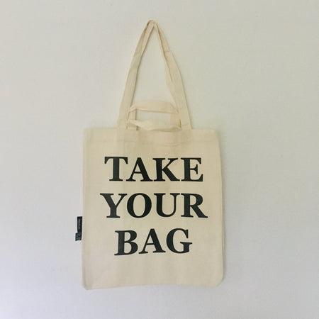 Beige TAKE YOUR BAG made of 100% organic cotton, NEUTRAL® and FAIRTRADE® certified with black print design.