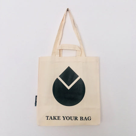 Beige TAKE YOUR BAG made of 100% organic cotton, NEUTRAL® and FAIRTRADE® certified with black WATER DROP design.