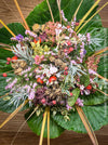Seasonal winter flower bouquet with fresh flowers and winter foliage