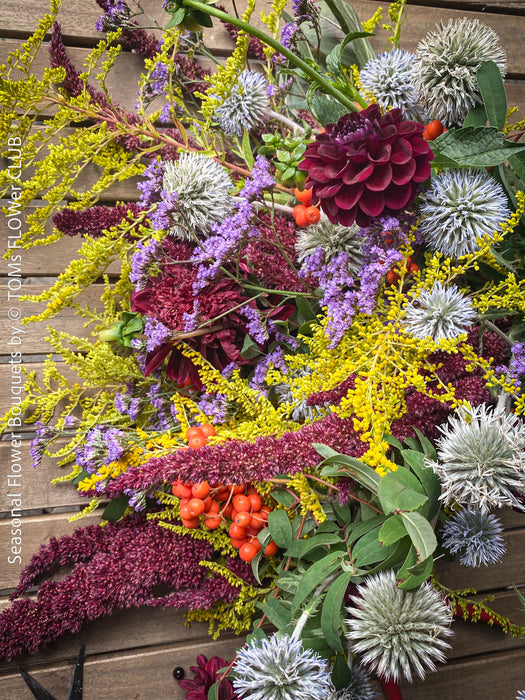 Elegant autumn bouquet with seasonal flowers, foliage and berries from TOMs FLOWer CLUB