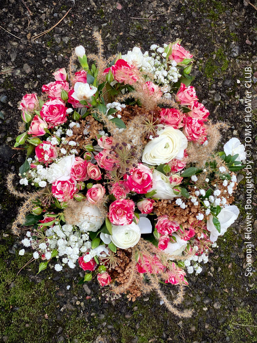 Elegant winter bouquet with seasonal flowers and natural branches with free delivery in Zurich