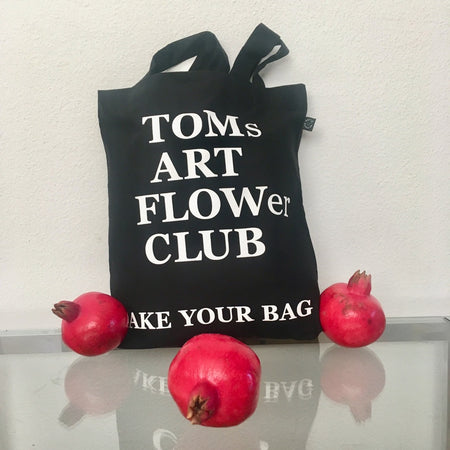 Black TAKE YOUR BAG with white TOMs ART FLOWer CLUB design by TOMs FLOWer CLUB made of 100% organic cotton, EarthPositive® certified, various colours, Swiss designed, premium quality, world wide shipping.