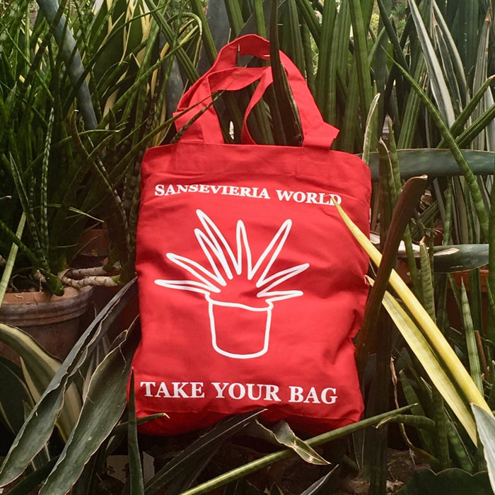 Red TAKE YOUR BAG with white SANSEVIERIA WORLD design by TOMs FLOWer CLUB made of 100% organic cotton, EarthPositive® certified, various colours, Swiss designed, premium quality, world wide shipping.