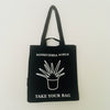 Black TAKE YOUR BAG made of 100% organic cotton, NEUTRAL® and FAIRTRADE® certified with white SANSEVIERIA WORLD design.