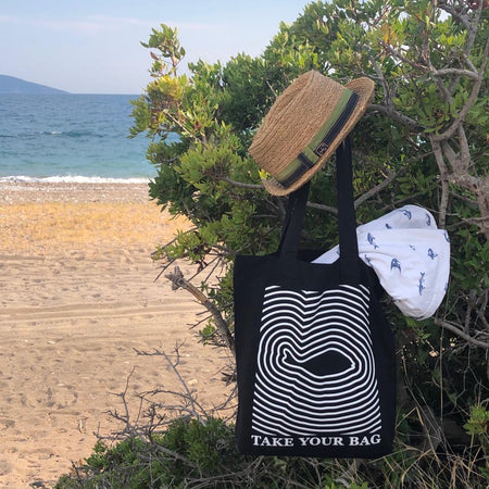 Black TAKE YOUR BAG with white FISH design by TOMs FLOWer CLUB made of 100% organic cotton, EarthPositive® certified, various colours, Swiss designed, premium quality, world wide shipping.