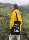 Black TAKE YOUR BAG with white design by TOMs FLOWer CLUB made of 100% organic cotton, EarthPositive® certified, various colours, Swiss designed, premium quality, world wide shipping.