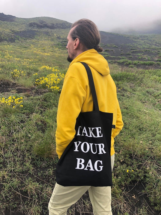 Black TAKE YOUR BAG with white design by TOMs FLOWer CLUB made of 100% organic cotton, EarthPositive® certified, various colours, Swiss designed, premium quality, world wide shipping.