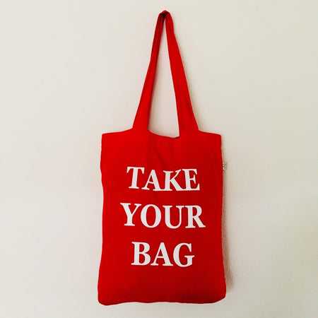 Red TAKE YOUR BAG with white design by TOMs FLOWer CLUB made of 100% organic cotton, EarthPositive® certified, various colours, Swiss designed, premium quality, world wide shipping.