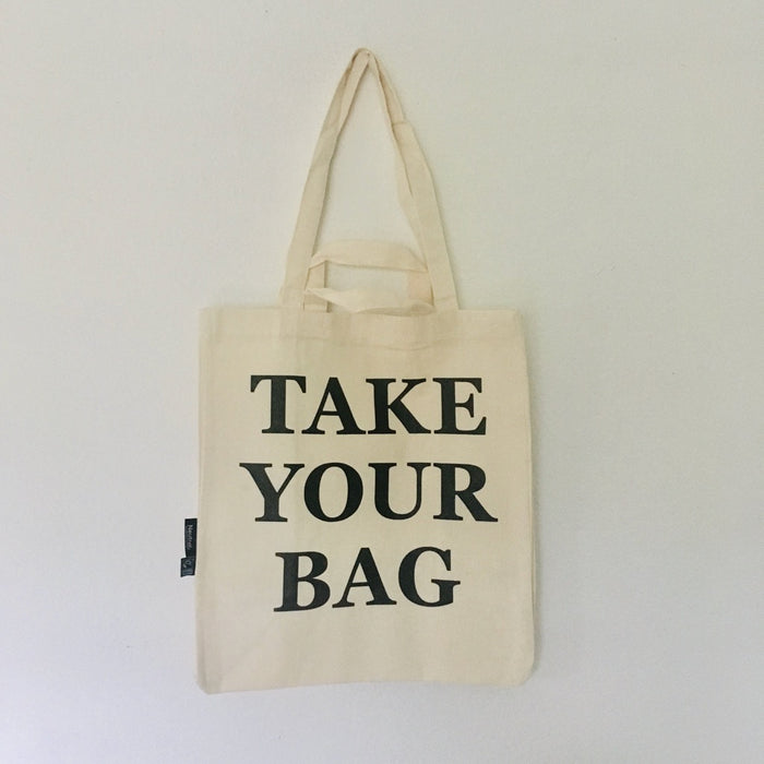 Beige TAKE YOUR BAG made of 100% organic cotton, NEUTRAL® and FAIRTRADE® certified with black print design.