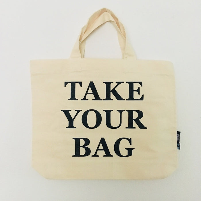 Beige TAKE YOUR BAG with black design made of 100% organic cotton, NEUTRAL® and FAIRTRADE® certified.