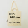 Beige TAKE YOUR BAG aus 100% Bio-Baumwolle, NEUTRAL® und FAIRTRADE® zertifiziert mit schwarzem HEY GIRL Design.