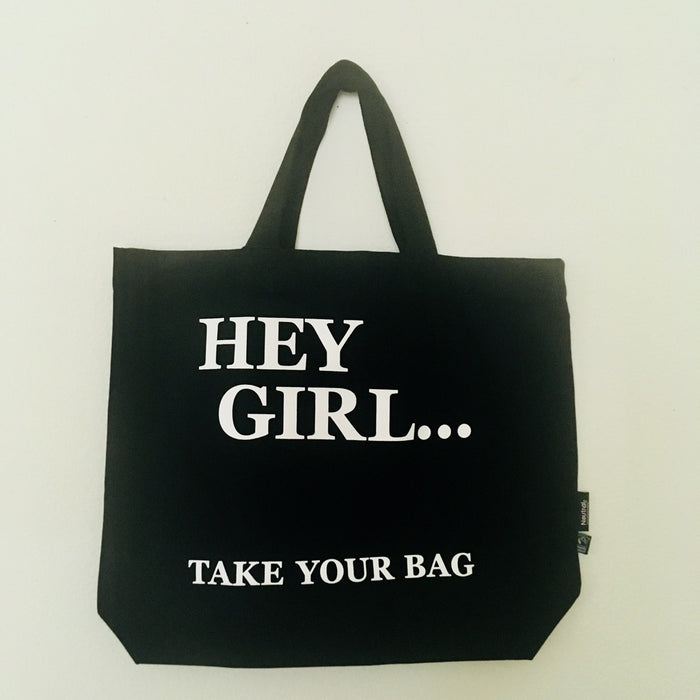 Black TAKE YOUR BAG with white HEY GIRL design made of 100% organic cotton, NEUTRAL® and FAIRTRADE® certified.