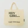Beige TAKE YOUR BAG with black HEY GIRL design made of 100% organic cotton, NEUTRAL® and FAIRTRADE® certified.