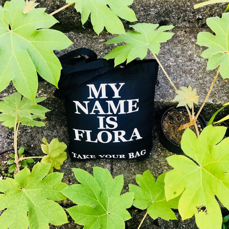 Black TAKE YOUR BAG with white MY NAME IS FLORA design by TOMs FLOWer CLUB made of 100% organic cotton, EarthPositive® certified, various colours, Swiss designed, premium quality, world wide shipping.