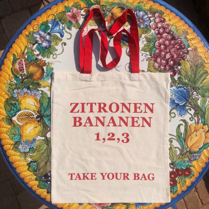 ZITRONEN, BANANEN, 1,2,3 - beige bag with red handle - 38 x 42 cm
