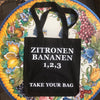 Black TAKE YOUR BAG with white ZITRONEN, BANANEN, 1,2,3 design by TOMs FLOWer CLUB made of 100% organic cotton, EarthPositive® certified, various colours, Swiss designed, premium quality, world wide shipping.