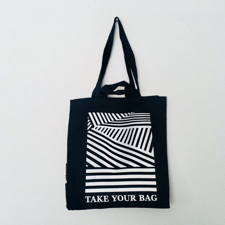 Black TAKE YOUR BAG made of 100% organic cotton, NEUTRAL® and FAIRTRADE® certified with white LINEAR design.