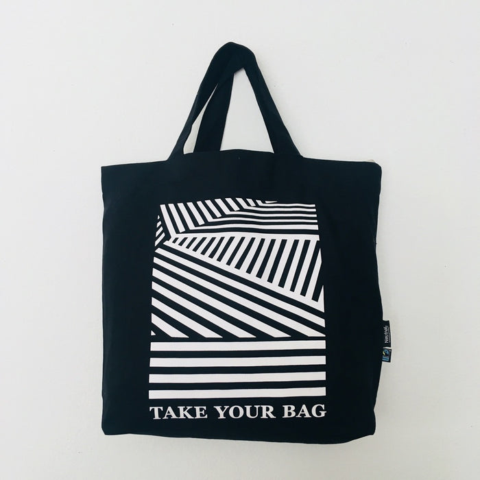 Black TAKE YOUR BAG with white LINEAR design made of 100% organic cotton, NEUTRAL® and FAIRTRADE® certified.
