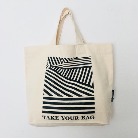 Beige TAKE YOUR BAG with black LINEAR design made of 100% organic cotton, NEUTRAL® and FAIRTRADE® certified.
