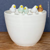 White, hand made, Handarbeit, unique, ceramic plant pot without drain hole with five colourful birds on the pot top directly from the artist's work shop, offered for sale by TOMs FLOWer CLUB.