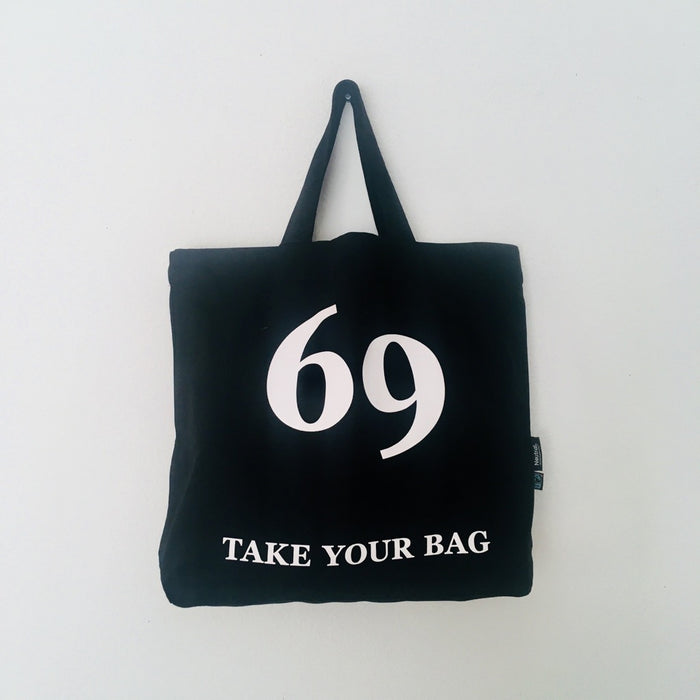 Black TAKE YOUR BAG with white BUY ART design made of 100% organic cotton, NEUTRAL® and FAIRTRADE® certified.