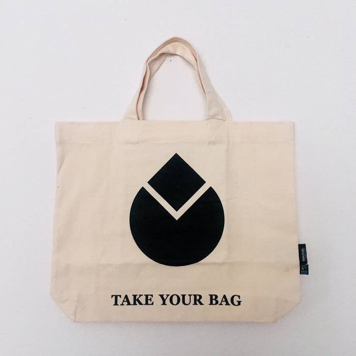 Beige TAKE YOUR BAG with black WATER DROP design made of 100% organic cotton, NEUTRAL® and FAIRTRADE® certified.