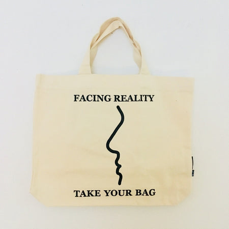Beige TAKE YOUR BAG with black FACING REALITY design made of 100% organic cotton, NEUTRAL® and FAIRTRADE® certified.