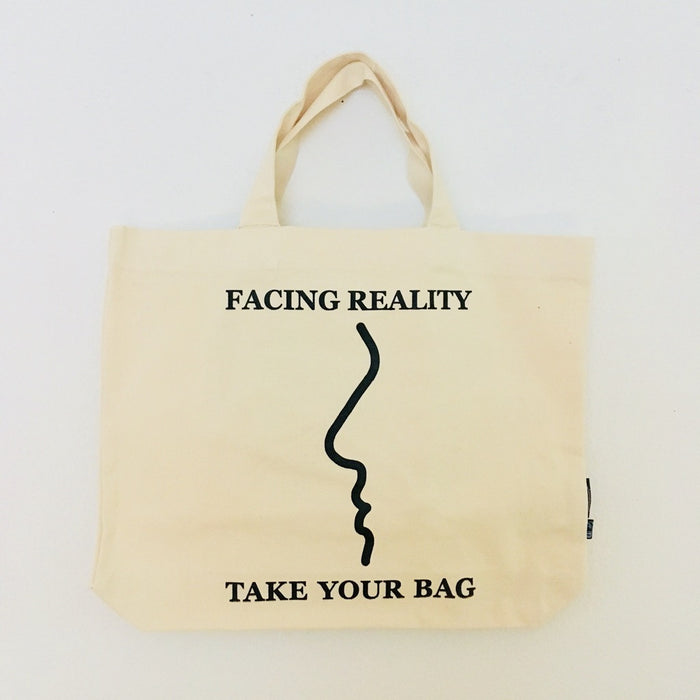 Beige TAKE YOUR BAG with black FACING REALITY design made of 100% organic cotton, NEUTRAL® and FAIRTRADE® certified.