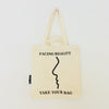 Beige TAKE YOUR BAG aus 100% Bio-Baumwolle, NEUTRAL® und FAIRTRADE® zertifiziert mit schwarzem FACING REALITY Design.