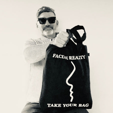 Black TAKE YOUR BAG with white FACING REALITY design by TOMs FLOWer CLUB made of 100% organic cotton, EarthPositive® certified, various colours, Swiss designed, premium quality, world wide shipping.
