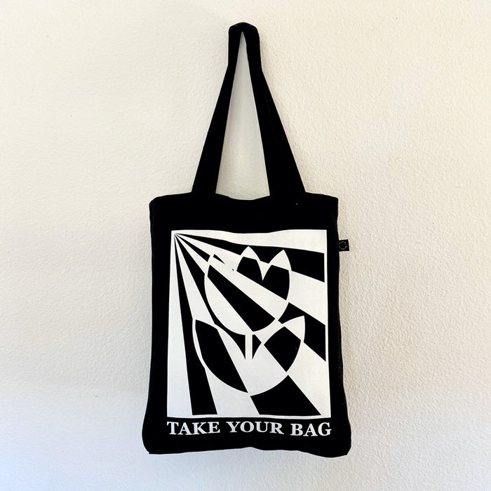 Black TAKE YOUR BAG with white TULIP design by TOMs FLOWer CLUB made of 100% organic cotton, EarthPositive® certified, various colours, Swiss designed, premium quality, world wide shipping.