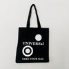 A black cotton tote bag with the text 'UNIVERSal' and 'TAKE YOUR BAG' printed in white on the front.