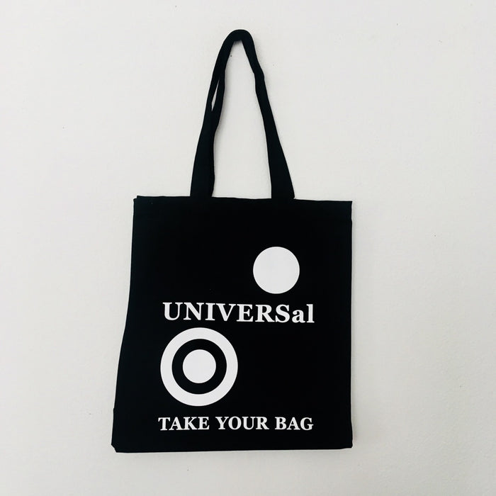 A black cotton tote bag with the text 'UNIVERSal' and 'TAKE YOUR BAG' printed in white on the front.