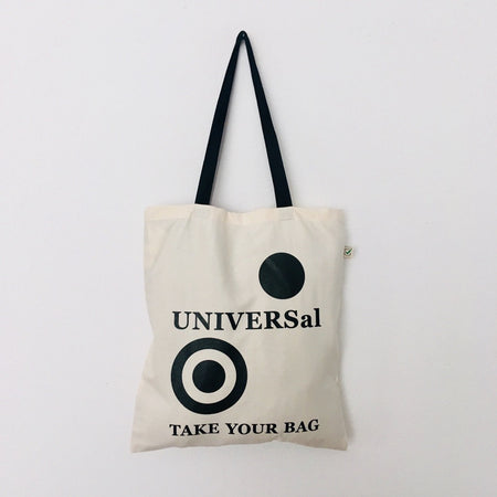 A beige cotton bag with a black handle, featuring the text 'UNIVERSal' and 'TAKE YOUR BAG' printed on the front.
