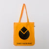 Gold-coloured cotton tote bag with a black water drop design and the text 'TAKE YOUR BAG' printed on the bottom.