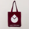 A burgundy tote bag with a white water drop design and text 'TAKE YOUR BAG' on the bottom.