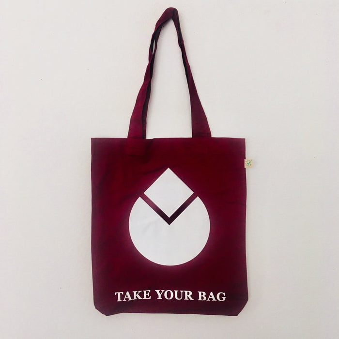 A burgundy tote bag with a white water drop design and text 'TAKE YOUR BAG' on the bottom.
